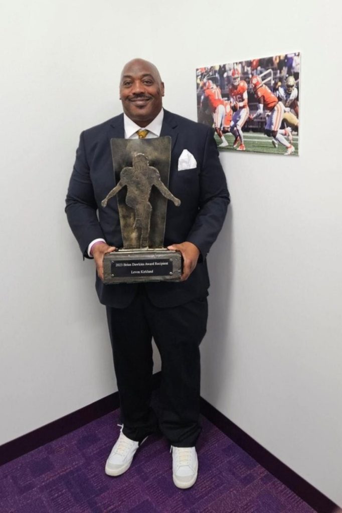 Levon Kirkland poses with a trophy