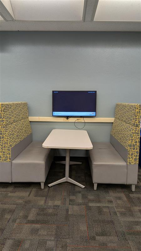 Booth seating with tv monitor.