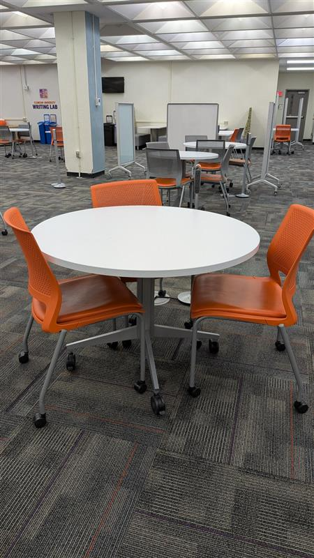 Collaborative seating with table and chairs on wheels.