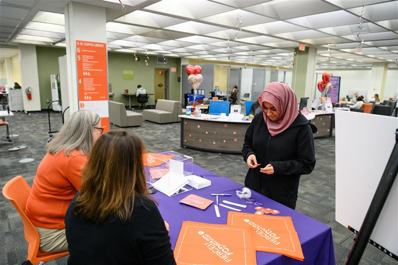 Student interacting with campus partner to learn about resources.