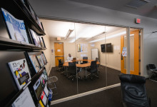 group study space in Gunnin library featuring wall mounted display, desk and available seating for 7