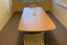 Study room with large whiteboard that can seat up to two students